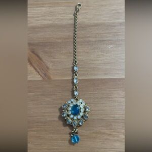 Maang tikka in gold and blue wedding party wear